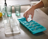 Joseph Joseph Flow Easy-fill Ice-cube Tray with lid for easy filling, 14 large cubes, reduces splashing, stackable design.