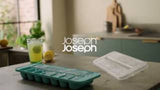 Joseph Joseph Flow Easy-fill Ice-cube Tray with linked cavities and stackable lid for effortless ice cube preparation.