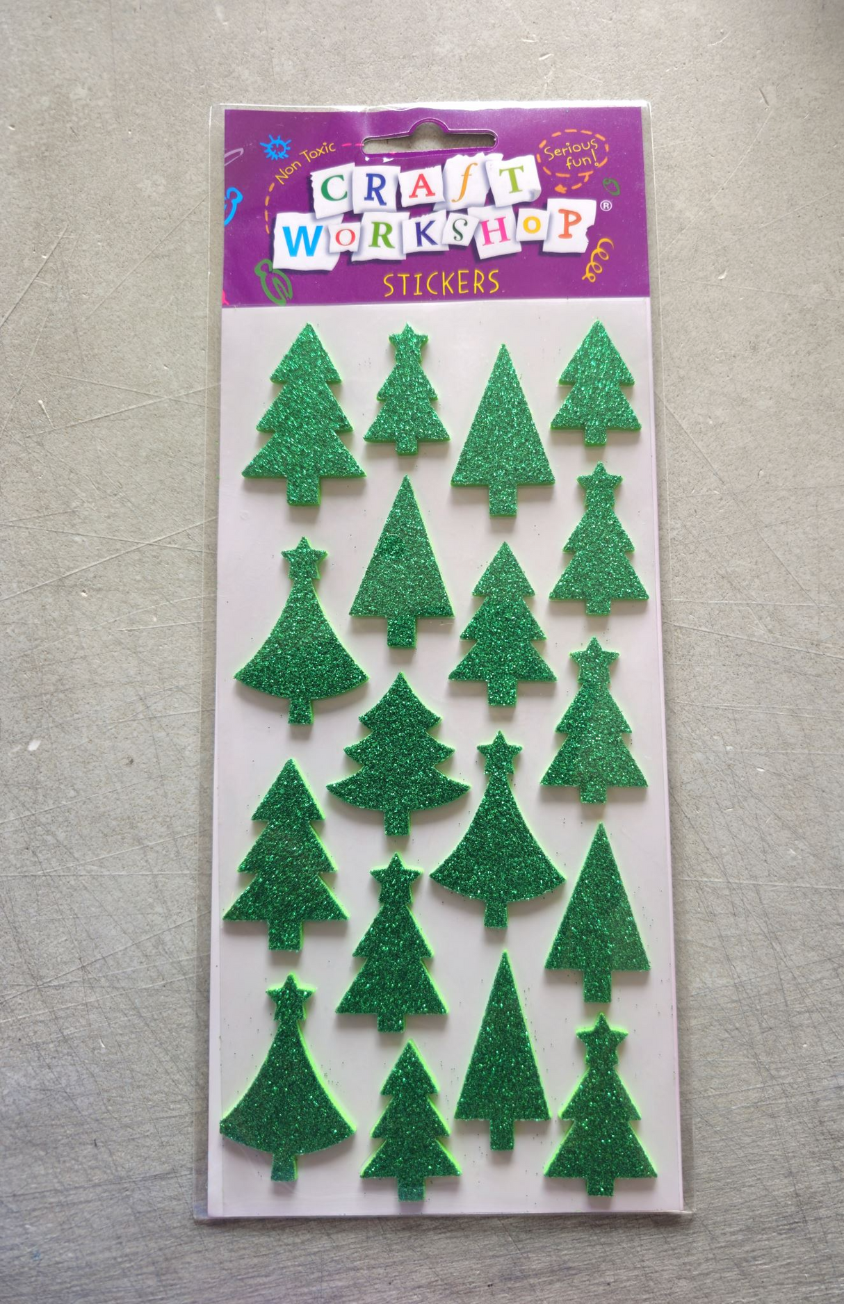 Festive soft stickers of colorful Xmas trees for holiday crafting, ideal for kids' projects and decorations.
