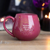 Pink color-changing mug revealing a mystical crystal ball with hidden message, perfect for whimsical tea time.