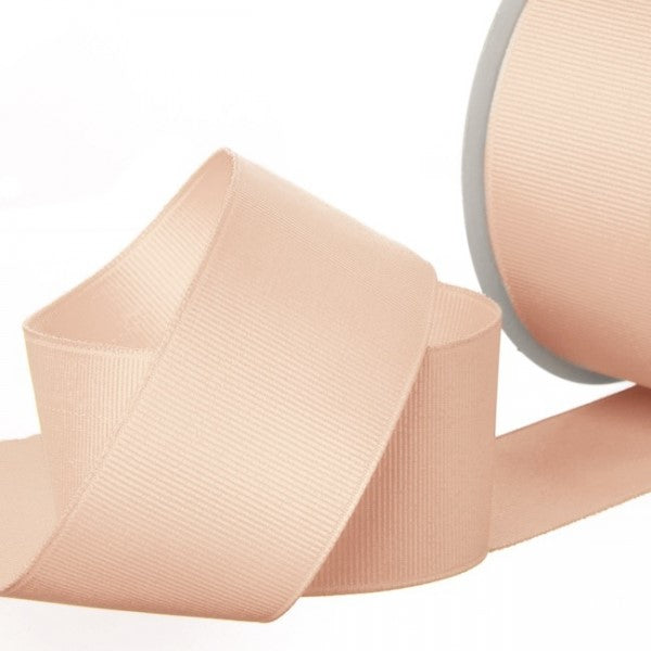Grosgrain ribbon in elegant nude, 38mm wide, 20m long; perfect for crafting, gift wrapping, and home decor.