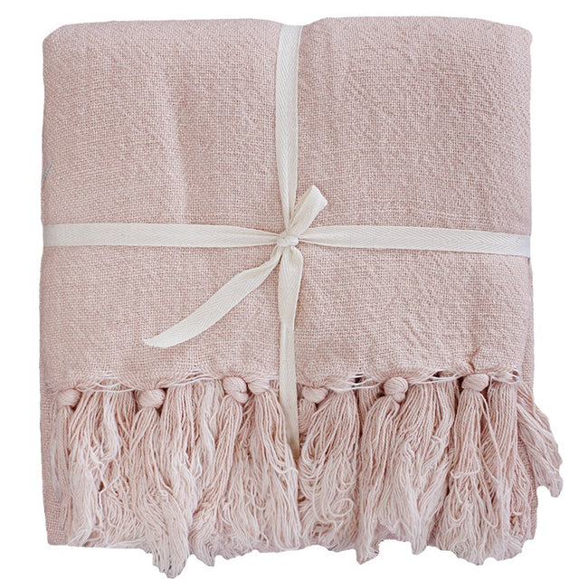 Lightweight Evening Pink throw blanket in linen/cotton blend, perfect for adding modern elegance and comfort to any room.
