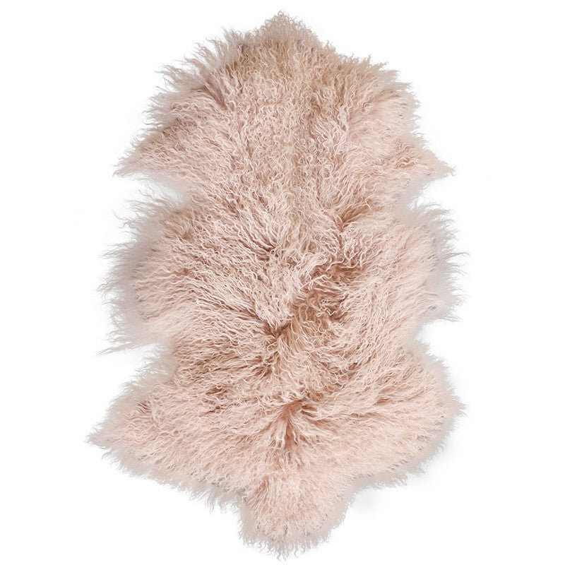 Soft blush pink Meru Tibetan Lamb Skin fur rug, 65x90cm, perfect for adding warmth and elegance to any decor.
