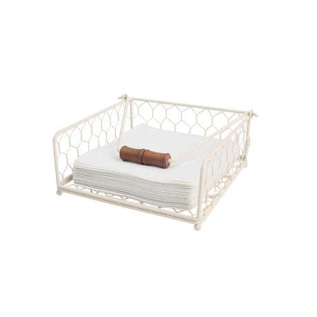 Elegant cream wire napkin holder with wooden toggle, designed for both style and practicality in dining spaces.