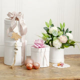 Elegant set of 5 round white flower boxes in varying heights for versatile floral arrangements and gifting.
