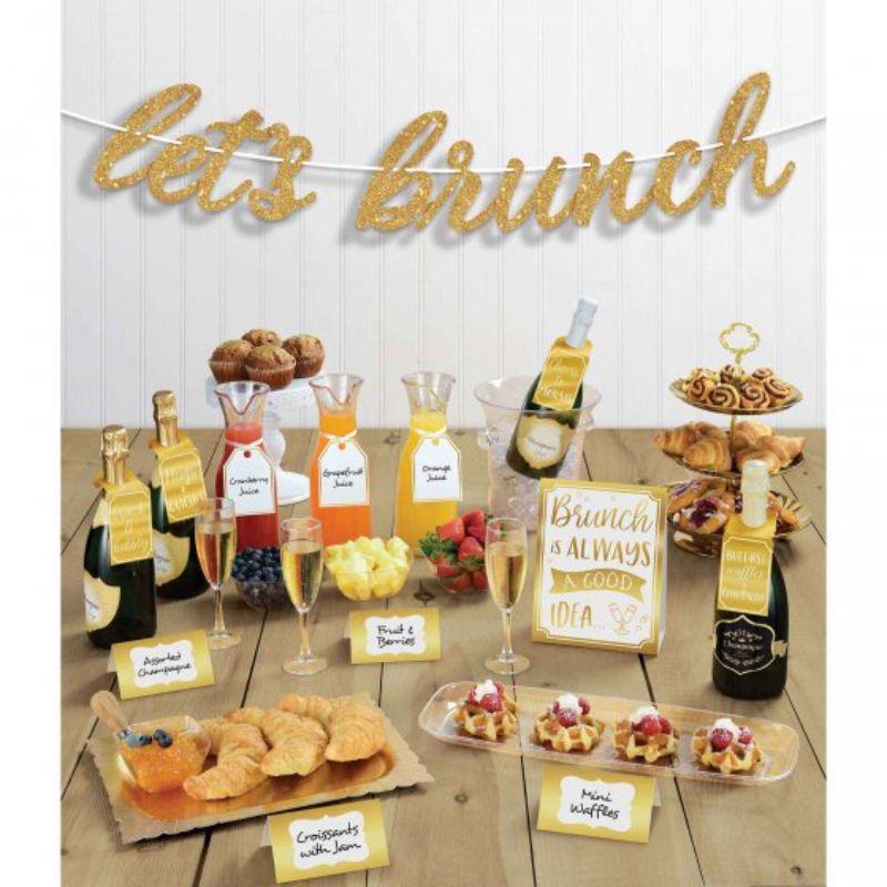 Mimosa Let's Brunch Decorating Kit featuring elegant tent cards, glass tags, bottle tags, and a glittered banner for stylish brunch events.