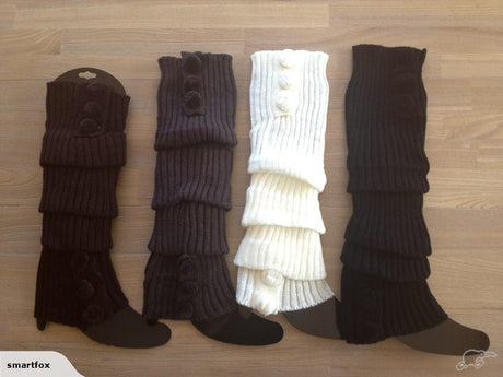 Stylish white cable knit leg warmers with pom-poms, 40cm long, soft and warm, perfect for winter fashion and gifting.