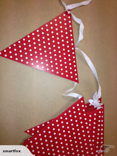 Vibrant 2.7m red dot bunting flags for festive celebrations, made of durable cardboard and double-sided for visibility.