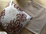 Retro Flower Brown cushion covers set of 2, featuring vibrant floral pattern on one side and plain fabric on the other.
