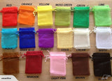 Small dark green organza bags with satin ribbon drawstring, perfect for gifts and favors, pack of 50.
