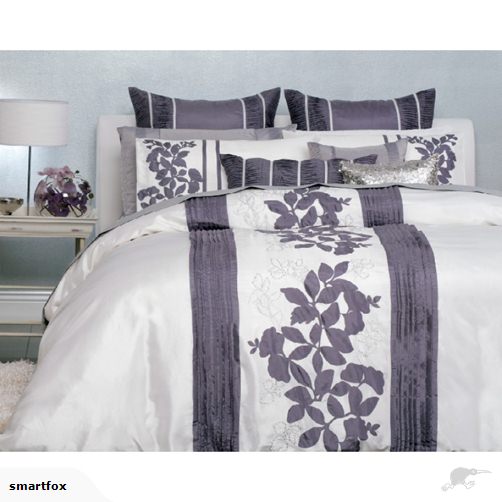 Duvet cover set in rich grape with elegant applique, embroidery, and pin tuck detailing for a luxurious bedroom look.