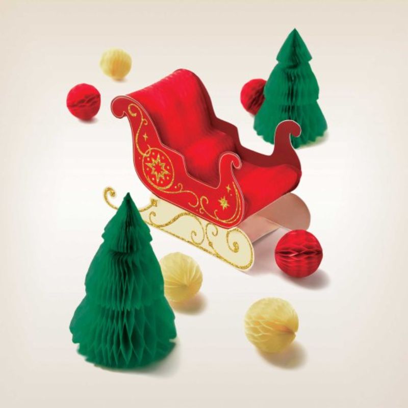 Colorful Christmas sleigh centerpiece kit with trees and ornaments, perfect for festive table decor and holiday celebrations.