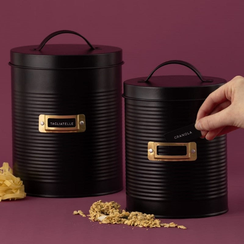 Set of two matte black storage canisters (2.4L & 3.5L) with stylish ribbed design and gold accents for elegant kitchen organization.