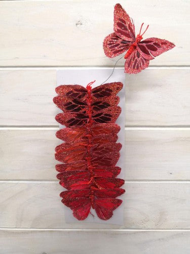 Red artificial butterflies with glitter, 9cm each, perfect for decorating and crafting, sold in sets of 12.