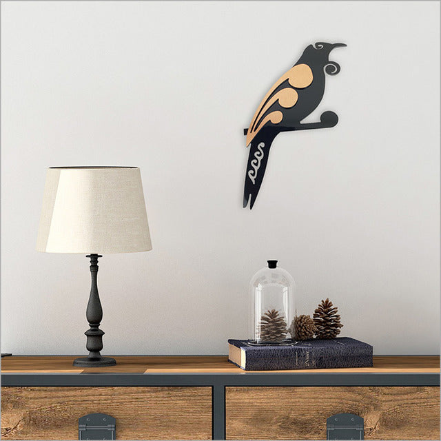 Wall art featuring a two-tone Tui bird design, made from durable aluminium composite for indoor/outdoor use.
