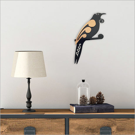 Wall art featuring a two-tone Tui bird design, made from durable aluminium composite for indoor/outdoor use.