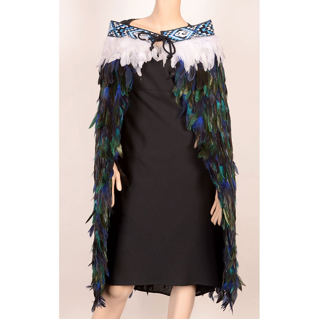 Stylish Korowai - Paua cloak featuring vibrant feathers and taniko trim, embodying Maori culture and craftsmanship.