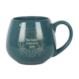 Green mug changes color with warm beverages, revealing hidden fortune design and message "Your future is not set in stone."