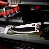 Compact stainless steel folding knife with key ring for safety, features a locking blade and includes a weatherproof box.