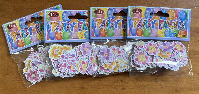 Colorful fairy and flower-themed party confetti in 4 packs, perfect for adding magic to celebrations and events.