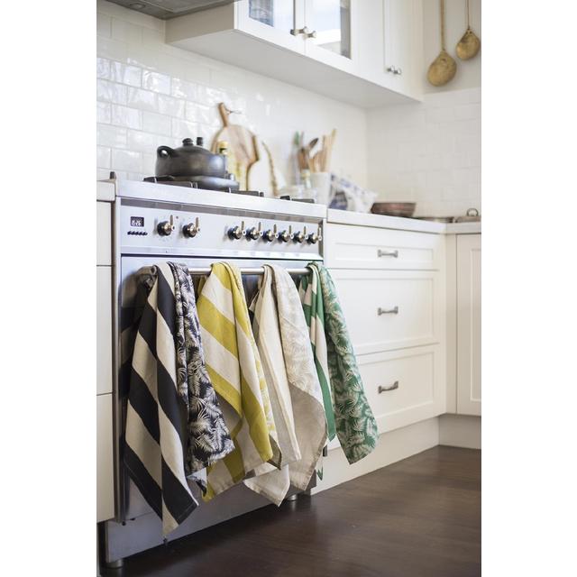 Set of 2 cotton tea towels in vibrant Amazon Green with tropical palm pattern for stylish kitchen decor and practicality.