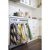 Set of 2 cotton tea towels in vibrant Amazon Green with tropical palm pattern for stylish kitchen decor and practicality.