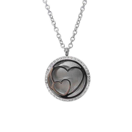 Heart-shaped Angel Caller locket with a brass bell, designed to attract positive energy and chime gently for protection.