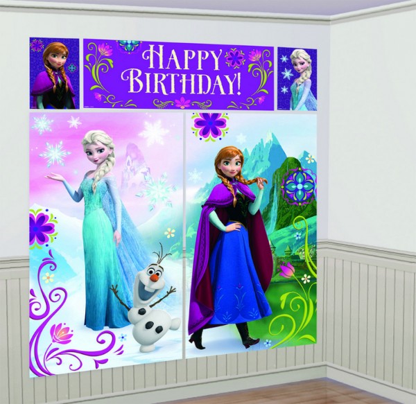 Colorful Frozen-themed party decorations featuring backdrops, a banner, and cutouts for a magical winter celebration.