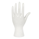 White ceramic palmistry hand ornament decorated with gold astrology symbols and the phrase 'Your fate is in your hands'.