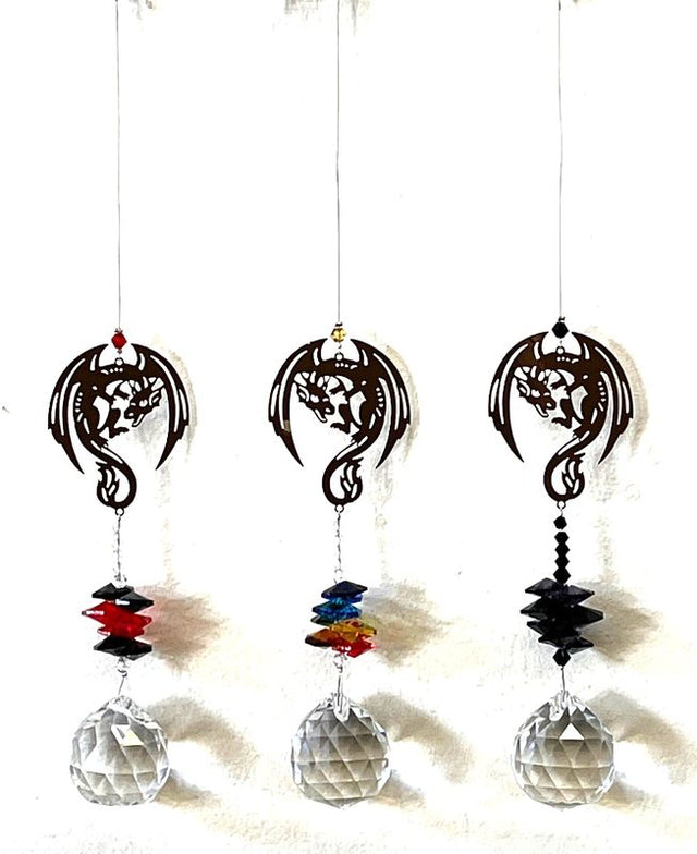 Colorful dragon-themed suncatchers in a set of 12, casting mesmerizing rainbows in sunlight for enchanting decor.