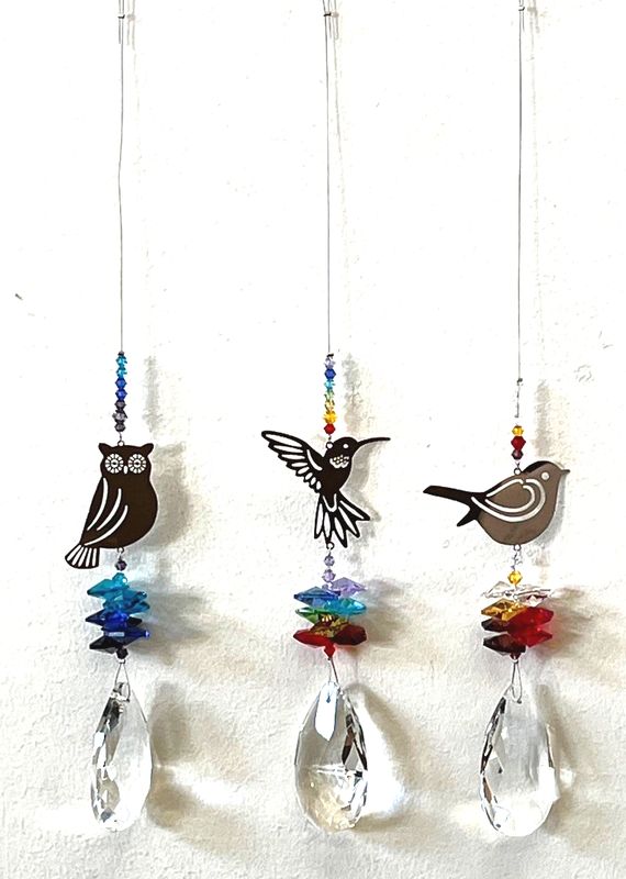 Set of 12 vibrant bird suncatchers that create stunning rainbow reflections in your home, perfect for any decor.