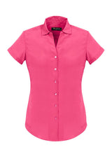 Melon short sleeve shirt for women with a semi-fitted design, crafted from soft-touch polyester for comfort and style.