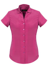 Solanda Ladies Short Sleeve Shirt in vibrant Melon, featuring a semi-fitted design and soft-touch polyester for ultimate comfort.