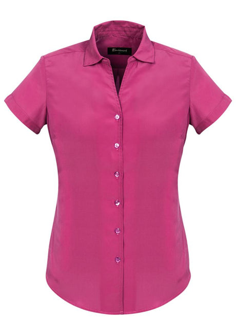 Solanda Ladies Short Sleeve Shirt in vibrant Melon, featuring a semi-fitted design and soft-touch polyester for ultimate comfort.