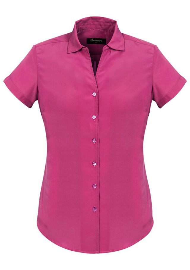 Solanda Ladies Short Sleeve Shirt in vibrant Melon, featuring a semi-fitted design and soft-touch polyester for ultimate comfort.