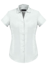 Solanda Ladies Plain Short Sleeve Shirt in white, featuring a semi-fitted design and soft-touch polyester for comfort.