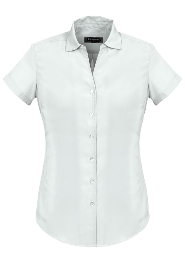 Solanda Ladies Plain Short Sleeve Shirt in white, featuring a semi-fitted design and soft-touch polyester for comfort.