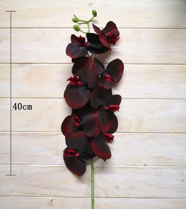 Burgundy Phalaenopsis Orchid artificial flower stem, life-like design, perfect for elegant home decor and low-light spaces.