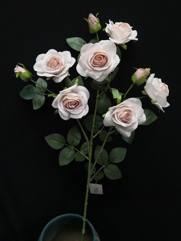 Artificial mauve pink rose spray with 9 lifelike buds, perfect for elegant home decor and maintenance-free styling.