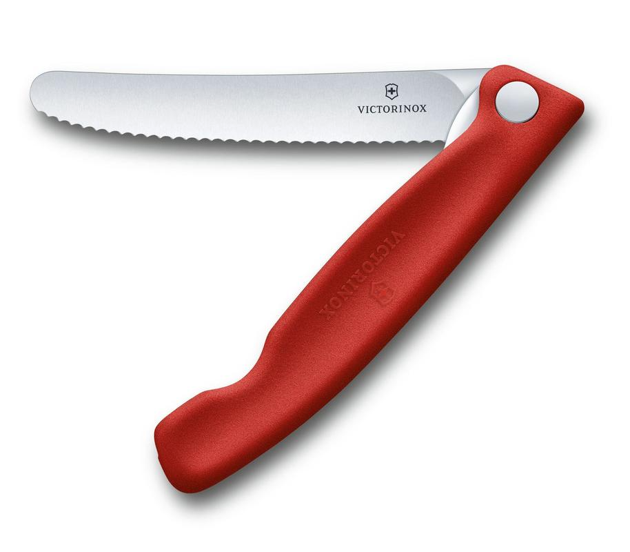 Victorinox Classic red foldable paring knife with wavy edge, perfect for peeling and chopping with style and convenience.