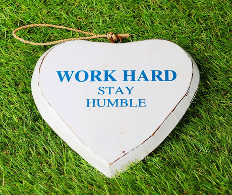 Hanging wooden heart decor with "Work Hard" text, 15x2x15 cm, perfect for inspiring motivation in any space.