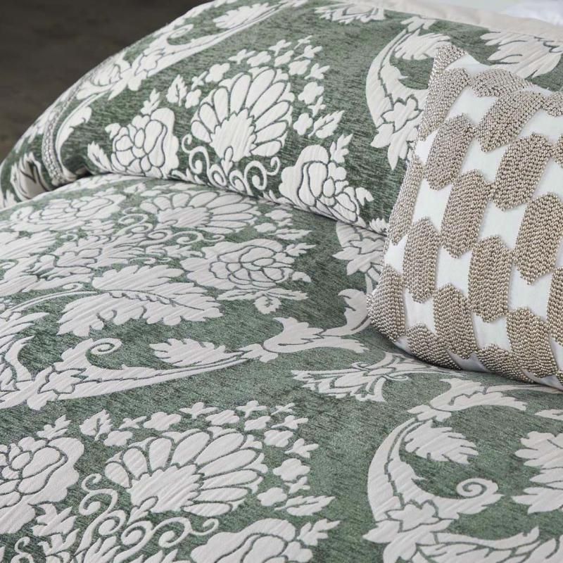 Davinci Coronet Sage Quilt Set features botanical motifs in soft chenille, perfect for a soothing, Hamptons-inspired bedroom.