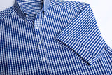 Men's short sleeve shirt in French Navy, featuring a yarn-dyed check pattern, button-down collar, and front pocket for essentials.