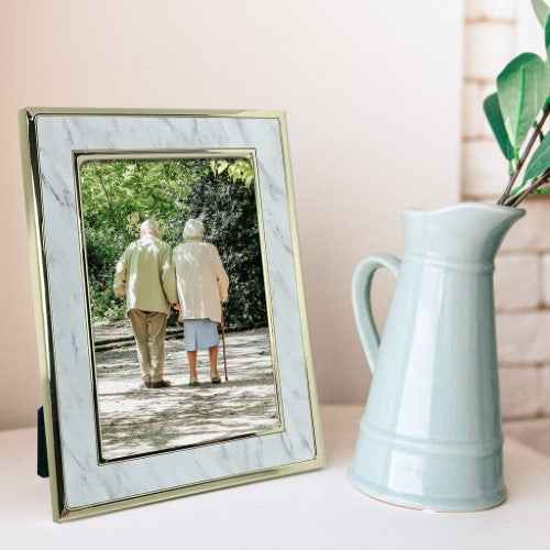 Elegant Terrazzo Marble Metal Photo Frame with gold edges, perfect for displaying cherished photos in various sizes.
