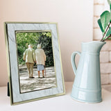 Elegant Terrazzo Marble Metal Photo Frame with gold edges, perfect for displaying cherished photos in various sizes.