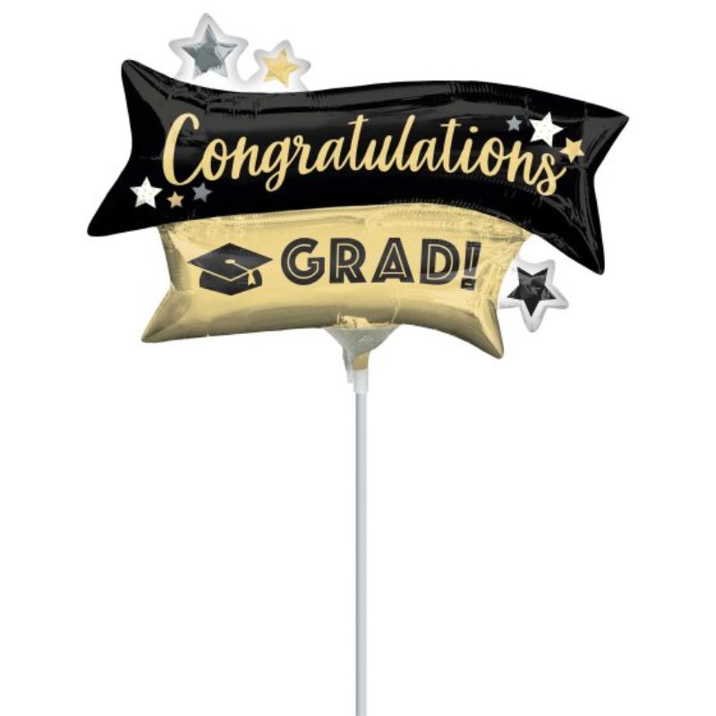 Mini gold and black foil balloon shaped like "GRAD" for elegant graduation celebrations, perfect for indoor or outdoor events.