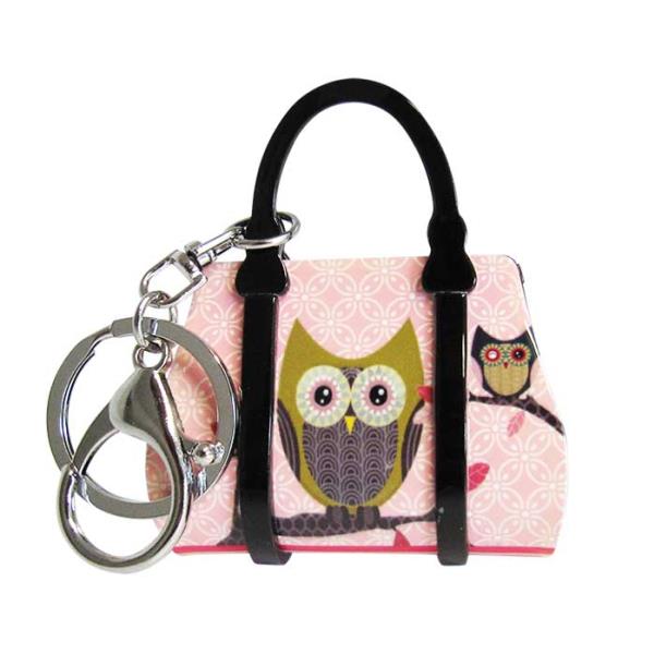 Adorable pink acrylic key ring handbag featuring whimsical owl design, perfect for essentials and stylish accessorizing.