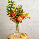 Artificial coral ranunculus spray with three ruffle blooms and realistic foliage, measuring 42cm in height.