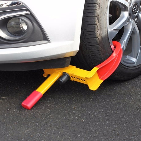 WILDCAT Wheel Clamp in bright color, made from hardened steel, offers secure vehicle protection and easy storage.