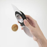 3-in-1 Avocado slicer with plastic blade, pit remover, and fan blade for easy slicing and serving of avocados.